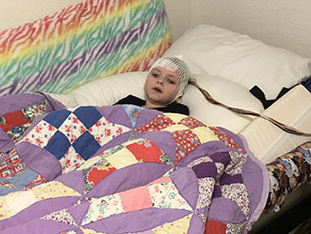 Sophia in bed w/ EEG Testing