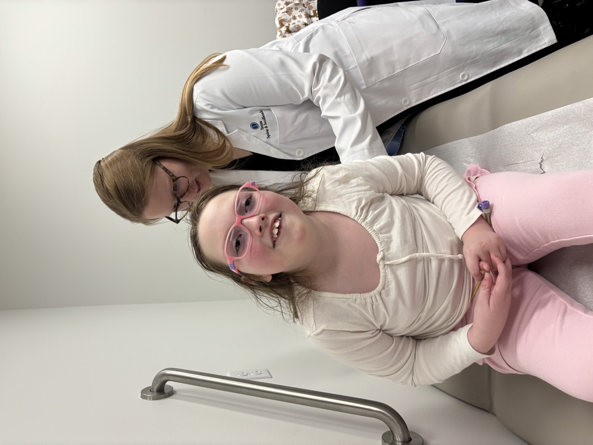 Sophia at a clinic appointment in 2025