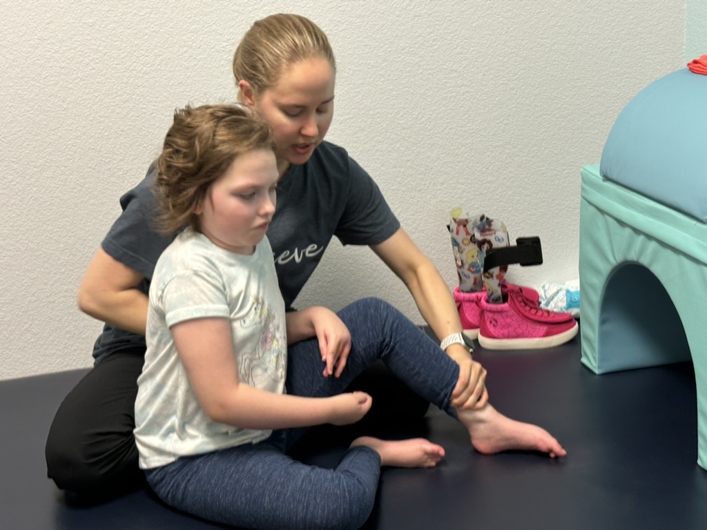 Sophia receiving hands-on therapy support in 2024