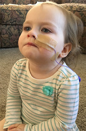 Sophia watching television with her NG-tube placed