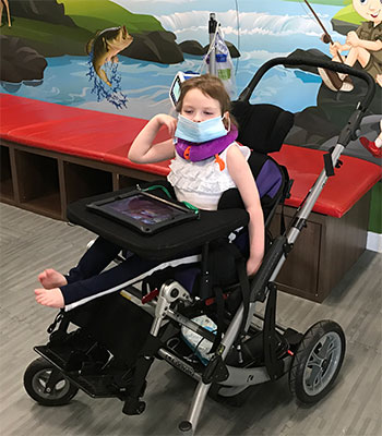Sophia in her wheelchair