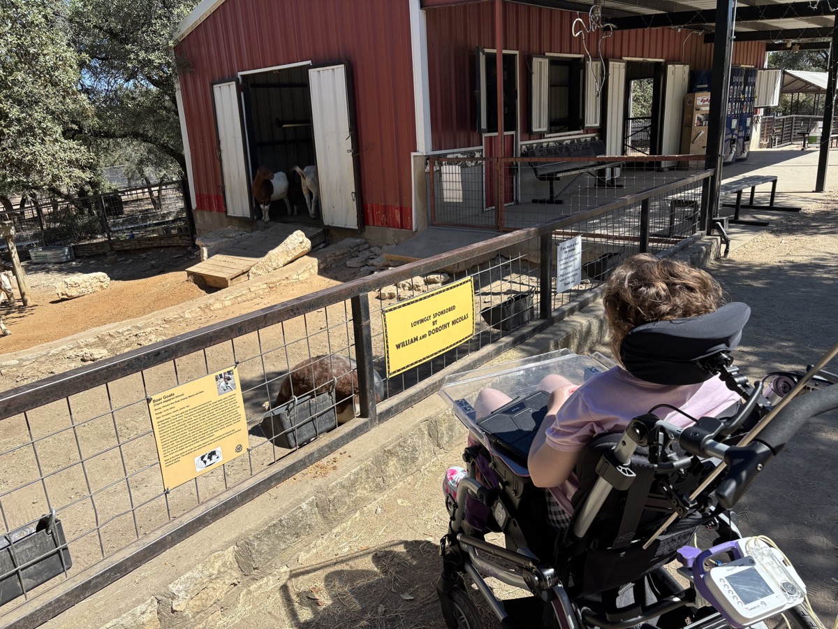 Sophia using her wheelchair during a community outing in 2025
