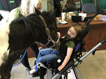 Sophia during horse therapy